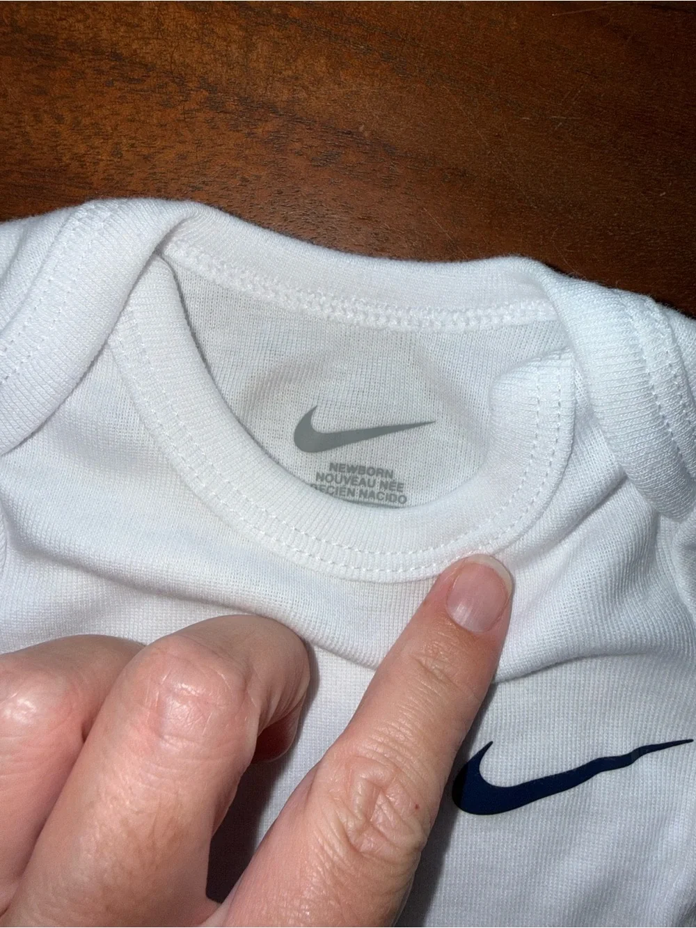 Nike‎ White Infant Bodysuit with Black Swoosh